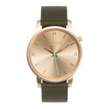 Load image into Gallery viewer, All gold Hervor watch with olive khaki green leather strap and a turquoise accent second hand