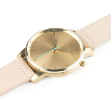 Load image into Gallery viewer, All gold Hervor watch with light pink skin tone leather strap and a turquoise accent second hand