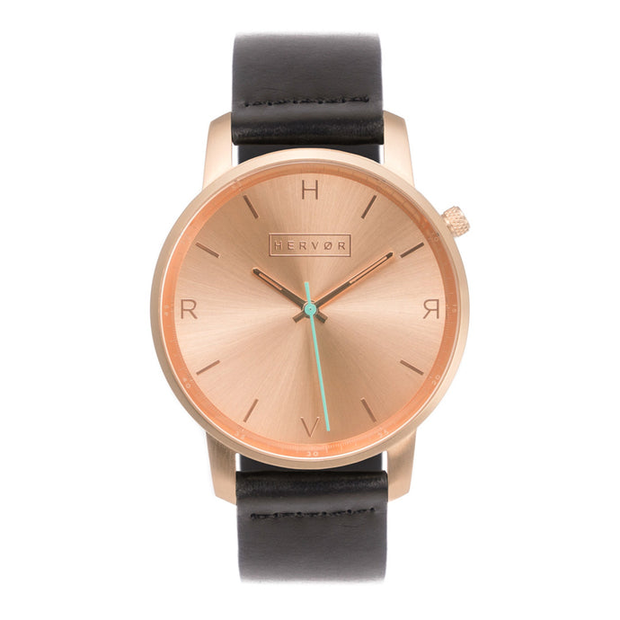 All rose gold Hervor watch with black leather strap and a turquoise accent second hand