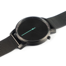 Load image into Gallery viewer, All black Hervor watch with black metallic mesh strap and a turquoise accent second hand