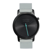 Load image into Gallery viewer, All black Hervor watch with dove grey leather strap and a turquoise accent second hand