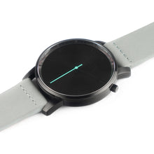 Load image into Gallery viewer, All black Hervor watch with dove grey leather strap and a turquoise accent second hand