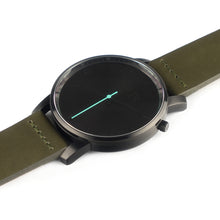 Load image into Gallery viewer, All black Hervor watch with olive khaki green leather strap and a turquoise accent second hand