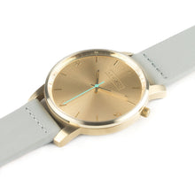 Load image into Gallery viewer, All gold Hervor watch with dove grey leather strap and a turquoise accent second hand