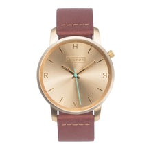 Load image into Gallery viewer, All gold Hervor watch with dusty rose dark pink leather strap and a turquoise accent second hand