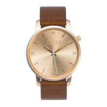 Load image into Gallery viewer, All gold Hervor watch with fox brown leather strap and a turquoise accent second hand