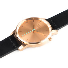 Load image into Gallery viewer, All rose gold Hervor watch with black leather strap and a turquoise accent second hand