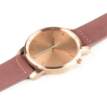 Load image into Gallery viewer, All rose gold Hervor watch with dusty rose dark pink leather strap and a turquoise accent second hand