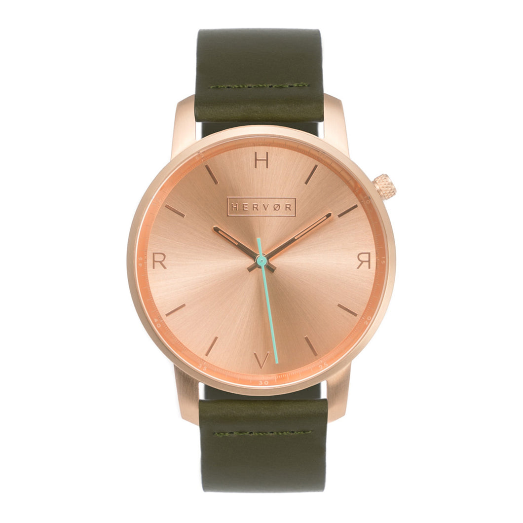 All rose gold Hervor watch with olive khaki green leather strap and a turquoise accent second hand