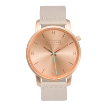Load image into Gallery viewer, All rose gold Hervor watch with light pink skin tone leather strap and a turquoise accent second hand