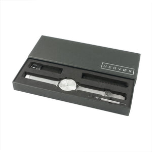 Silver Hervor watch in black packaging includes strap adjustment tool