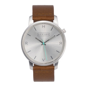 All silver Hervor watch with fox brown leather strap and a turquoise accent second hand