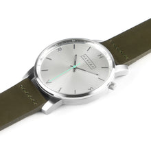Load image into Gallery viewer, All silver Hervor watch with olive khaki green leather strap and a turquoise accent second hand