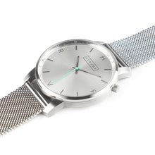 Load image into Gallery viewer, All silver Hervor watch with silver metallic mesh strap and a turquoise accent second hand